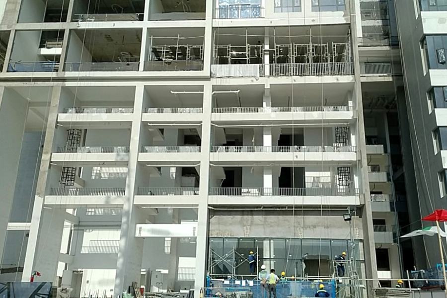 Construction of external facade at retail podium